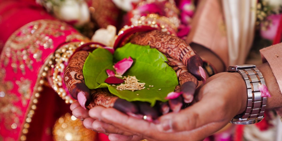 Picture of a traditional Hindu Indian wedding ceremony, showcasing some details
